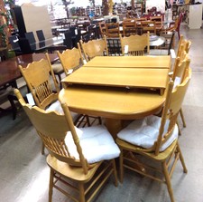 YELLOW OAK Large dining set.  Table has rounded corners, center is pedestal, comes with 2 lef, 8 high-back caned chairs, and white cushions.
$1795.00