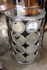 Silver side table with round mirror details
$45.80