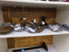 Find antique irons as well as the shoe molds for different sizes complete with the stands (at bottom) but each piece is sold separately.  Find at front of store white shelves
$21.50