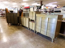 LARGE DRESSER SET.  You get 2 6 dwr dressers like the one closest in photo (his n hers) then an 8 dwr long dresser with mirror, plus 2 matching side tables.  Well made probably from 60's .
$800.00