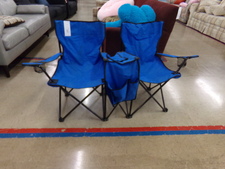 DOUBLE SITTER.  This camping loveseat is just one example of collapsible chairs we have on display.  
$36.00