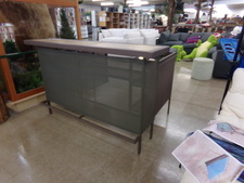 OUTDOOR PATIO BAR
This bar is metal and glass .  The back side opens up with work stations but will fold in for storage.  Has foot rest on front side.  
$295.00