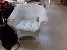 WICKER CHAIR WITH CUSHION.  Very nice condition - real wicker.  Has curved arm and back rest.  
$75.00