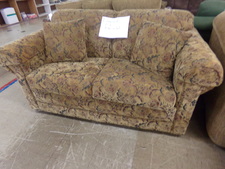 GOLD TAPESTRY a bit of pink floral blended in.  
TWIN HIDE-A-BED. 
Fabric is protected by Guardsman.  
$350.00