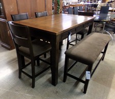 Tall dark wood table with a bench and 4 barstools
All seats have dark brown upholstery.  Easy sit/stand height.
$545.00