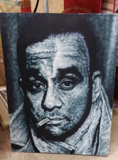 Man on canvas.  Just one of the pictures available in our department.  
$45.00