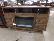 FIREPLACE/TV STAND.  6 ft long.  Has colored stone fire and heater.  Very attractive cabinet.
$700.00