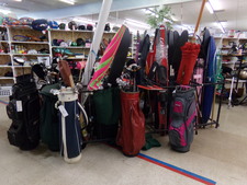 SPORTING GOODS!  This is just one rack of water skiis and lots of golf clubs.  Featured is the complete set in red bag in center.  
$100.00