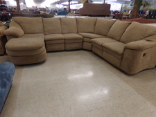 TAN SECTIONAL.  has a Chaise Lounge and a recliner.  5 pieces total.
$755.00