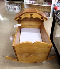 BABY CRADLE..  Home crafted pine cradle.  Very nice and strong.  has mattress in bottom.  
$125.00