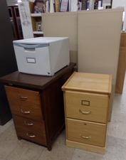 FILE CABINETS...  Find over with the desks.  small 2 drawer - large uprights facing the other way - and also pictured separately a large vertical file cabinet.  
$22.50