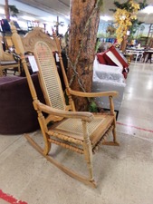 ROCKING CHAIR.  Tall high back, oak, caned seat and back.  needs a bit of polishing
$175.00
