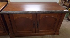 Dark wood and brown stone cabinet - has electrical inside to use as a TV Stand
$506.30