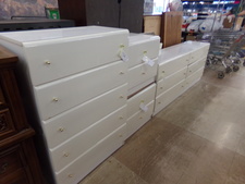 WHITE SMOOTH BEDROOM SET.  Glossy easy to clean finish with shiny brass knobs.  You get upright chest of drawers, long horizontal dresser & 2 side tables. 
$293.30