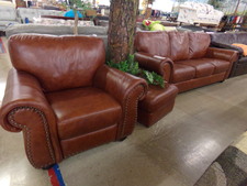 SMOOTH LEATHER.  Brown Couch, Chair and Ottoman sold as a set.  In new condition.  
$1295.00