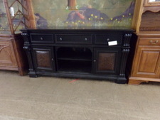 BLACK SIDE BAR CABINET.  Listing says TV stand, but that is just one use.  This could be in any room of the house.  3 drawers, 2 side cabinets, center shelves.
$375.00