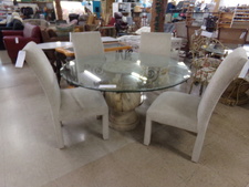 Dining table with pillar base and round glass top
Comes with 4 upholstered chairs
$495.00