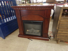 Wood electric fire place/heater.  Fit in corner of room
$165.00