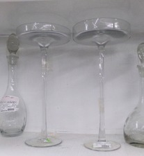 These thin stemmed glass items are listed as candle holders.  They are 15