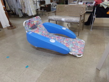 FLOATING CHAIR...  metal frame chair supported by large blue floating arms with cup holders.
$35.00